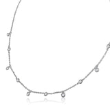 A classic must-have to complement any look, this rainfall 18k gold necklace features 11 set diamonds