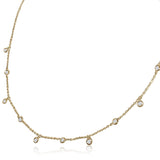 A classic must-have to complement any look, this rainfall 18k gold necklace features 11 set diamonds