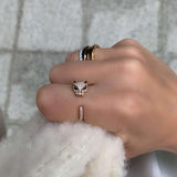 One of a kind Jaguar diamond ring, the ultimate statement piece, handmade and delicately crafted to bring forward every detail of the design. Simple open ring with dispersed diamonds and emerald eyes. 18k solid Gold