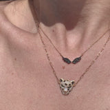 Beautiful black diamond wing necklace to symbolize the rise of Beirut from ashes! All proceed from the sales will go the Lebanese Red Cross.    18K Solid Gold (2.7g), 54 Diamond stones (0.24 carats), MADE IN BEIRUT!