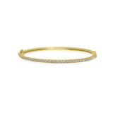 A classic thin Diamond bangle bracelet, elegant, effortless on its own and magnificent layered. The bangle has a safety clasp to keep it in place.  Available in 18K yellow, white and rose Gold.