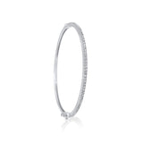 A classic thin Diamond bangle bracelet, elegant, effortless on its own and magnificent layered. The bangle has a safety clasp to keep it in place.  Available in 18K yellow, white and rose Gold.
