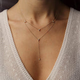 A classic must-have to complement any look, this diamond 18k gold necklace features 9 diamond droplets in an elegant set up to add a delicate shine to your "décolleté". Wear it alone or layered! Available to order in rose, white and yellow gold with an adjustable chain at 14 & 16 inches.