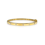 14K solid Gold (8.2g), 7 Diamonds (0.35 carats) A gorgeous classic bangle bracelet with 7 perfect diamonds that would go perfectly alone or stacked for the perfect arm candy! The bangle has a safety clasp to keep it in place. Available in Yellow, White and Rose Gold.