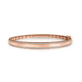14K solid Gold (9.7g), Pavé Diamonds (0.5 carats). A gorgeous bangle bracelet that would go perfectly alone or stacked for the perfect arm candy! The bangle has a safety clasp to keep it in place. Available in Yellow, White and Rose Gold.