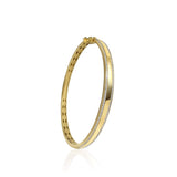 14K solid Gold (9.7g), Pavé Diamonds (0.5 carats). A gorgeous bangle bracelet that would go perfectly alone or stacked for the perfect arm candy! The bangle has a safety clasp to keep it in place. Available in Yellow, White and Rose Gold.