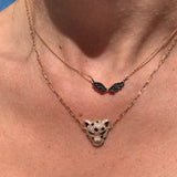 Beautiful black diamond wing necklace to symbolize the rise of Beirut from ashes! All proceed from the sales will go the Lebanese Red Cross.    18K Solid Gold (2.7g), 54 Diamond stones (0.24 carats), MADE IN BEIRUT!