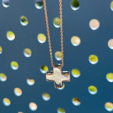 18K Pure Gold (5g). Made to resemble the swiss cross, this delicate pendant can be worn by adults and children and makes the perfect gift that defies the test of time. Available to order in Rose, White and Yellow gold. Chain is adjustable to 16, 18 and 20in (40, 45 and 50 cm), refer to the size guide for reference. Engraving of the letter of your choice is complimentary!