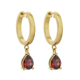 Specifications: 18K Gold (2.75g), 2 Red Garnet Pear Stones (0.8 carats)  A must in every girl’s jewelry box, these huggies are perfect for everyday wear and would complement any ear stack.   Sold as a pair. Available in 18k yellow, rose and white gold.