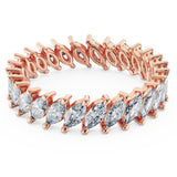 18k Pure Gold (3.5g) & ~2 carats of Marquise Diamonds (varies based on ring size). Eternity Diamond Ring with slanted marquise diamonds setting making this ring a gorgeous statement piece or a unique wedding band! Available in 18K white, rose & yellow gold.