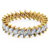 18k Pure Gold (3.5g) & ~2 carats of Marquise Diamonds (varies based on ring size). Eternity Diamond Ring with slanted marquise diamonds setting making this ring a gorgeous statement piece or a unique wedding band! Available in 18K white, rose & yellow gold.