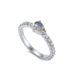 Full Eternity band with a pear shaped Moonstone Birthstone. 18K gold