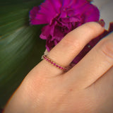 18K solid gold band of Rubies perfect for stacking. Band width ~2mm.