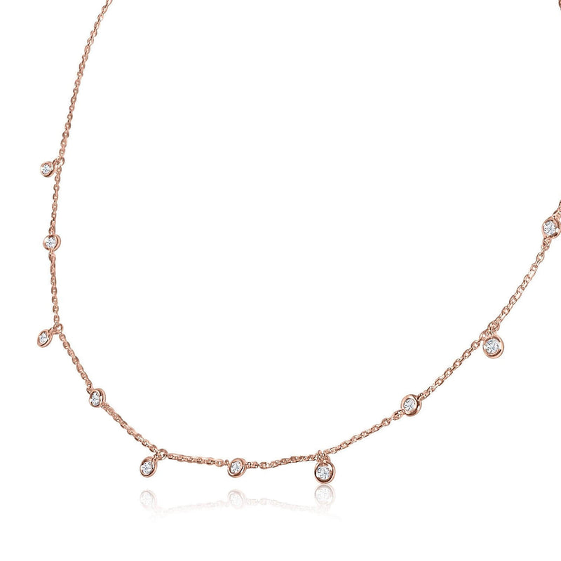 A classic must-have to complement any look, this rainfall 18k gold necklace features 11 set diamonds