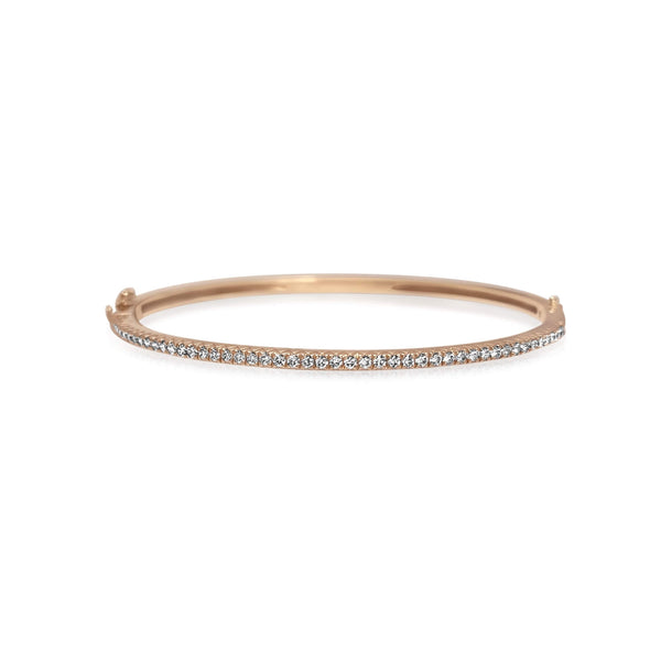 A classic thin Diamond bangle bracelet, elegant, effortless on its own and magnificent layered. The bangle has a safety clasp to keep it in place.  Available in 18K yellow, white and rose Gold.