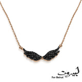 Beautiful black diamond wing necklace to symbolize the rise of Beirut from ashes! All proceed from the sales will go the Lebanese Red Cross.    18K Solid Gold (2.7g), 54 Diamond stones (0.24 carats), MADE IN BEIRUT!